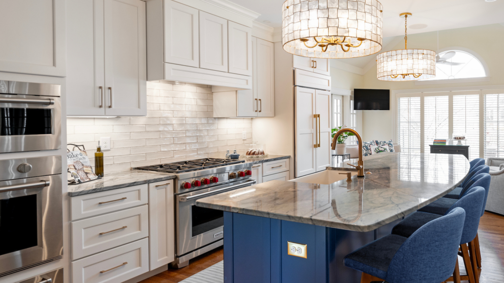 Custom kitchen remodel in Lexington KY featuring shaker cabinets, marble countertops, blue island, and brass fixtures by BACK Construction