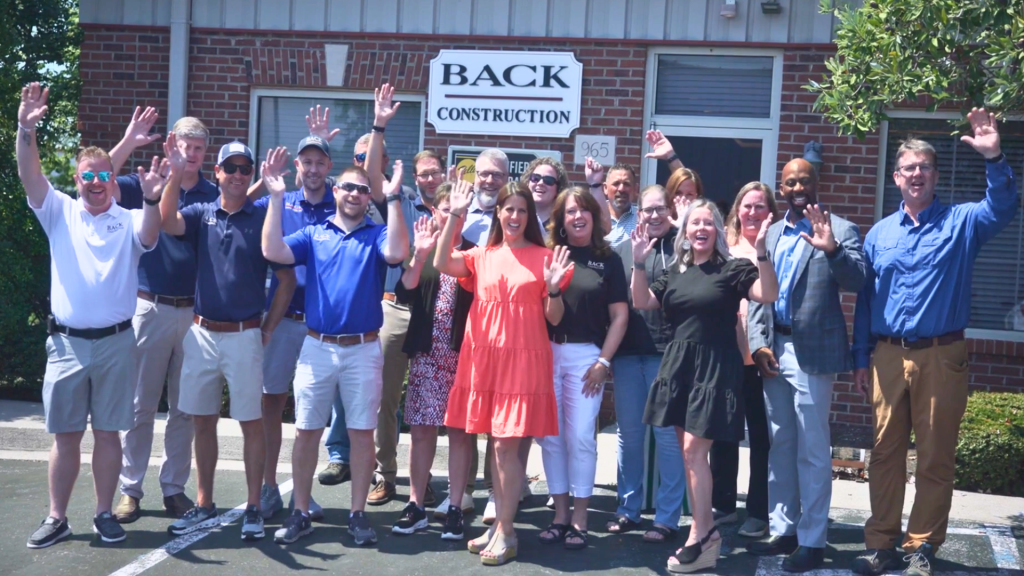 BACK Construction team gathered outside headquarters celebrating 100% employee ownership