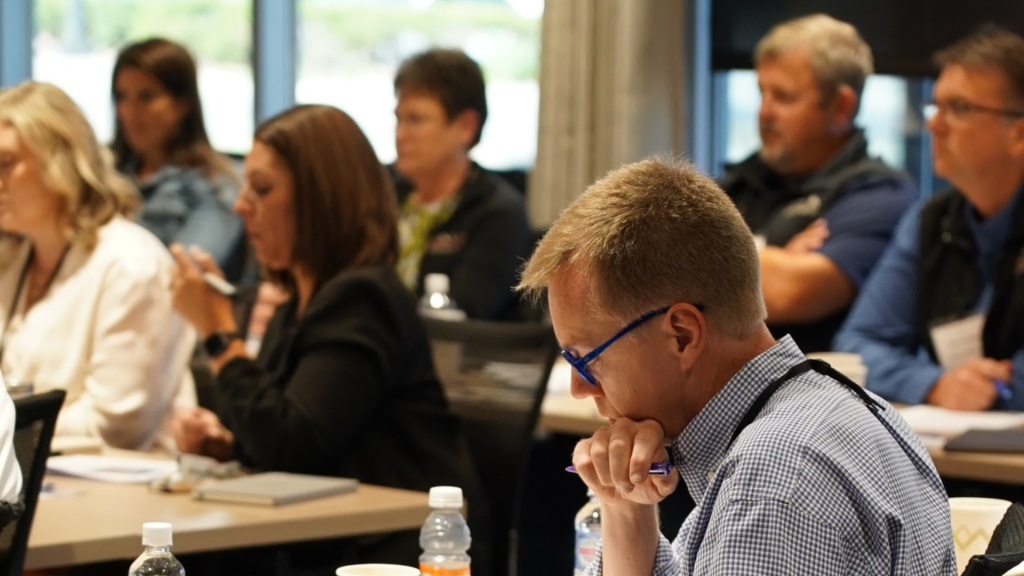 BACK Construction employee-owners engaged in a leadership and training session